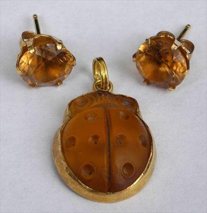 Appraisal: TIFFANY GLASS SCARAB PENDANT TOGETHER WITH A PAIR OF STUD