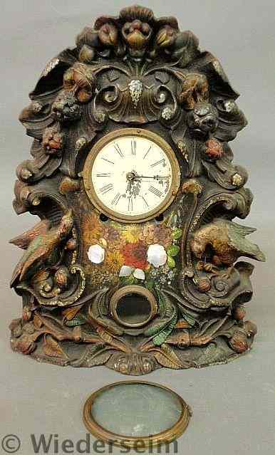 Appraisal: Victorian cast iron mantle clock with bird and floral decoration