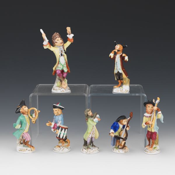 Appraisal: SEVEN PIECE GERMAN PORCELAIN MONKEY ORCHESTRA German polychromed porcelain monkey