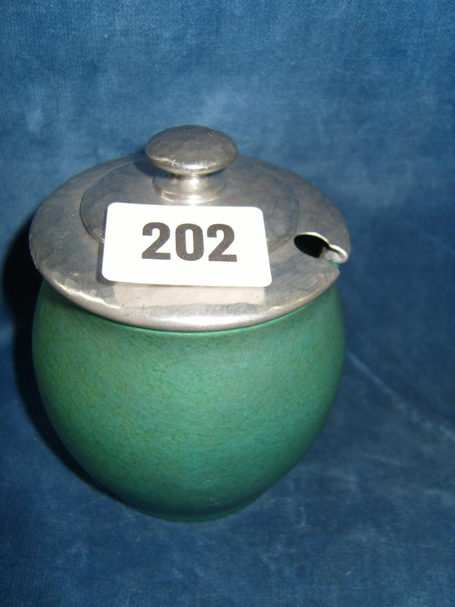 Appraisal: A Pilkingtons Royal Lancastrian jam pot with mottled green glaze