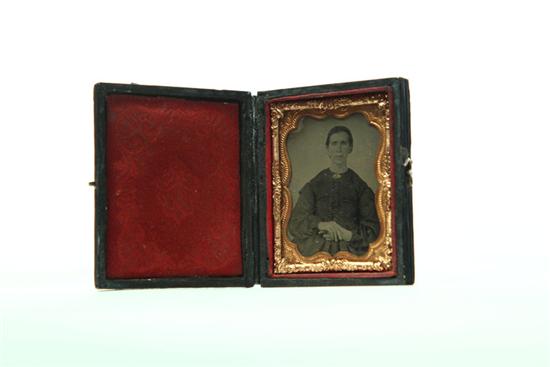 Appraisal: NINTH PLATE TINTYPE PORTRAIT OF A WOMAN American rd quarter-