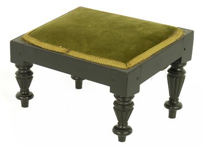 Appraisal: An Anglo-Indian ebony footstool the sloping covered top on turned