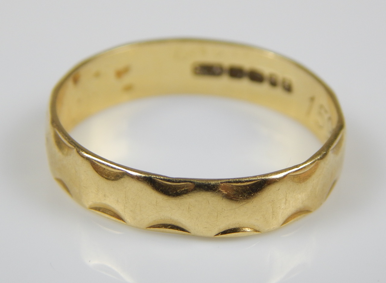 Appraisal: An ct gold wedding band with banded edges g all