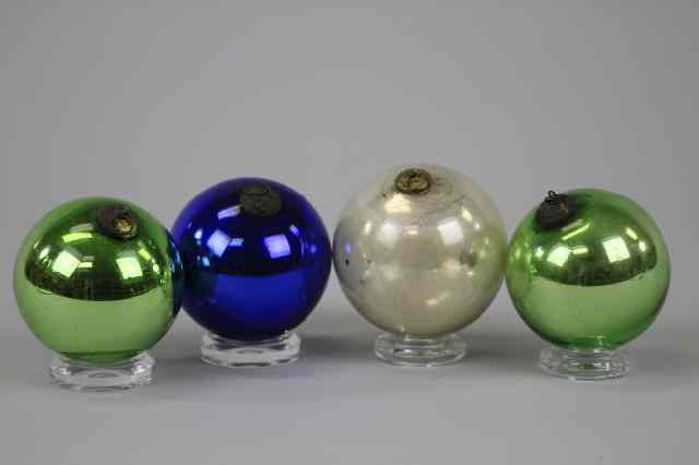 Appraisal: GROUP OF FOUR GLASS KUGELS Germany one in cobalt blue