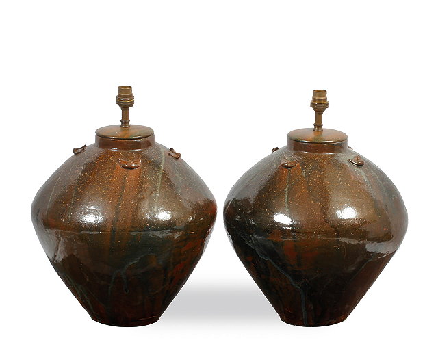 Appraisal: A PAIR OF VIETNAMESE STONEWARE OVOID JARS converted for use