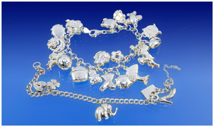 Appraisal: Silver Charm Bracelet Loaded With Charms Comprising Football Alarm Clock