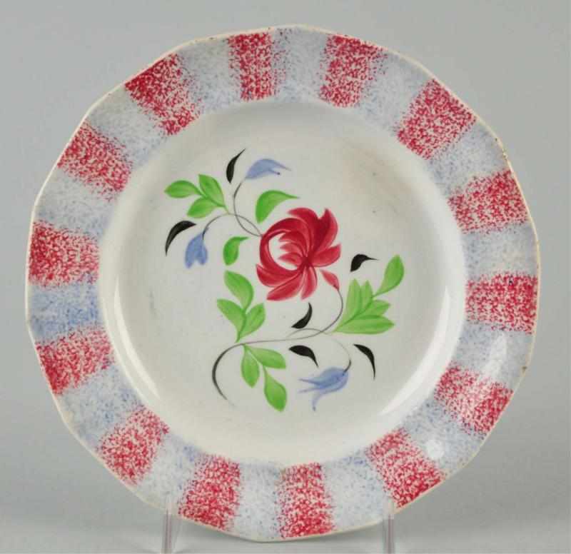 Appraisal: Spatterware Plate Description Circa Red and blue rainbow edging with