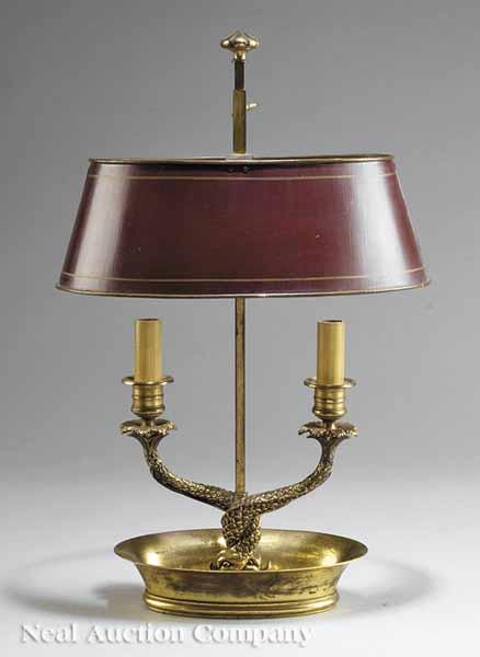 Appraisal: A French Classical-Style Brass Bouillotte Lamp two circular candlecups above