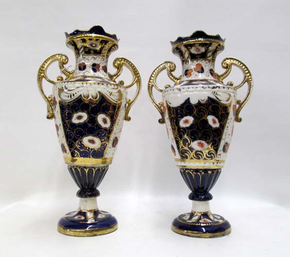 Appraisal: PAIR ENGLISH PORCELAIN URNS Imari pattern with blue orange and