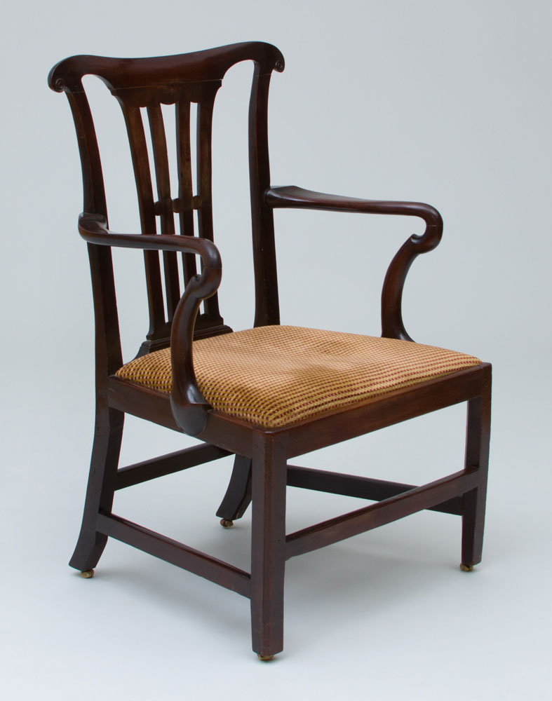 Appraisal: GEORGE III CARVED MAHOGANY ARMCHAIR Fitted with a drop seat