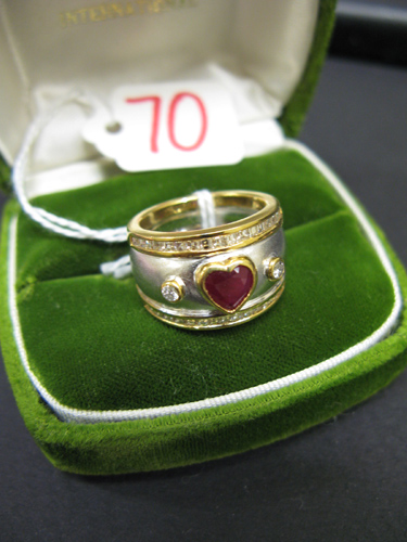 Appraisal: RUBY DIAMOND AND FOURTEEN KARAT YELLOW AND WHITE GOLD RING