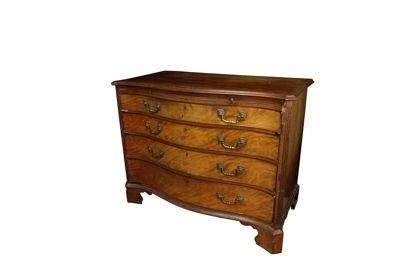 Appraisal: A late th Century mahogany serpentine front chest with stepped