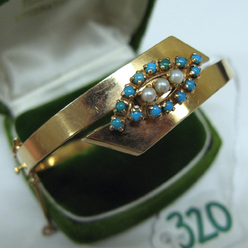 Appraisal: TURQUOISE PEARL AND FOURTEEN KARAT GOLD BANGLE The oval shaped