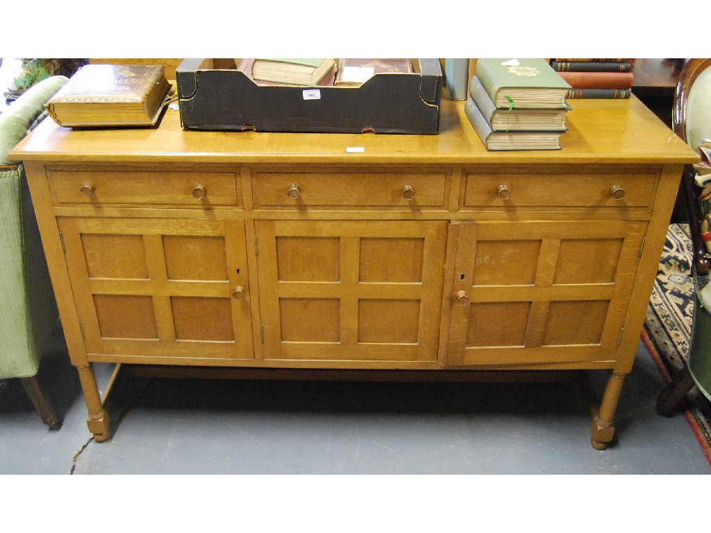 Appraisal: A light oak sideboard by Heal Son three frieze drawers