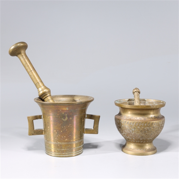 Appraisal: Two antique Indian brass mortars and pestles one with incised