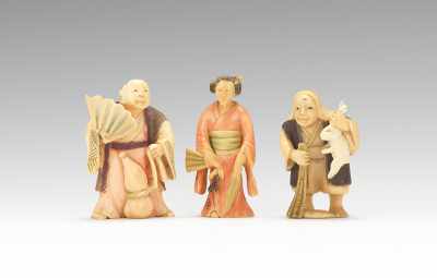 Appraisal: Three Carved and Polychromed Netsuke Including a man holding a