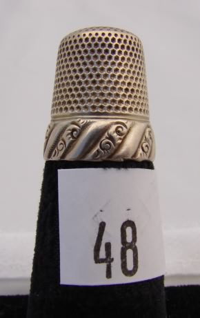 Appraisal: Sterling KMD thimble with designs on band