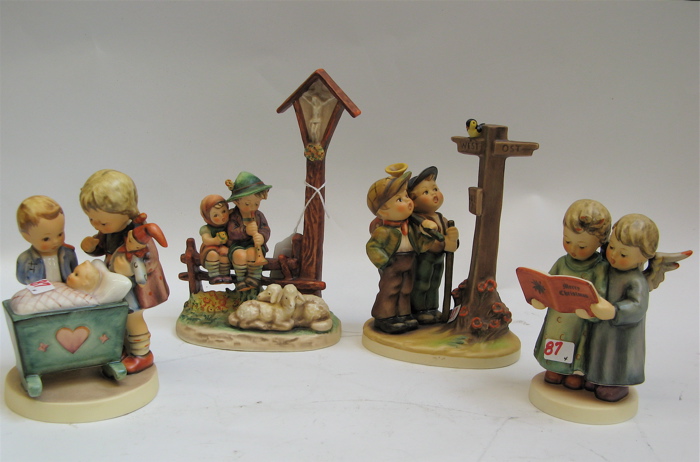 Appraisal: GROUP OF FOUR GERMAN HUMMEL FIGURES Blessed Event HUM -