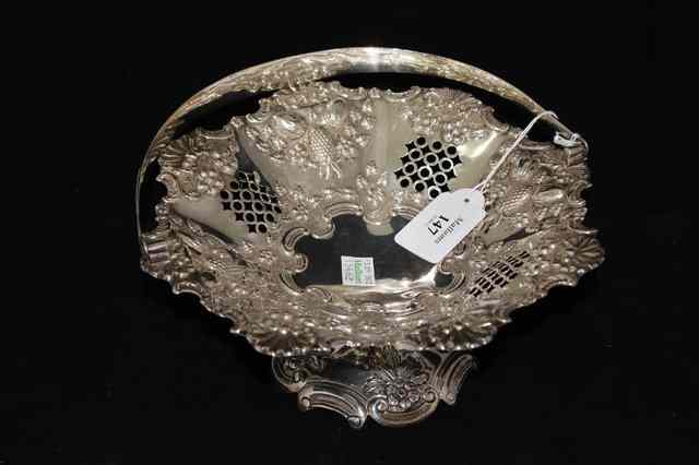 Appraisal: AN EDWARDIAN SILVER BASKET with pierced decoration and pressed melon