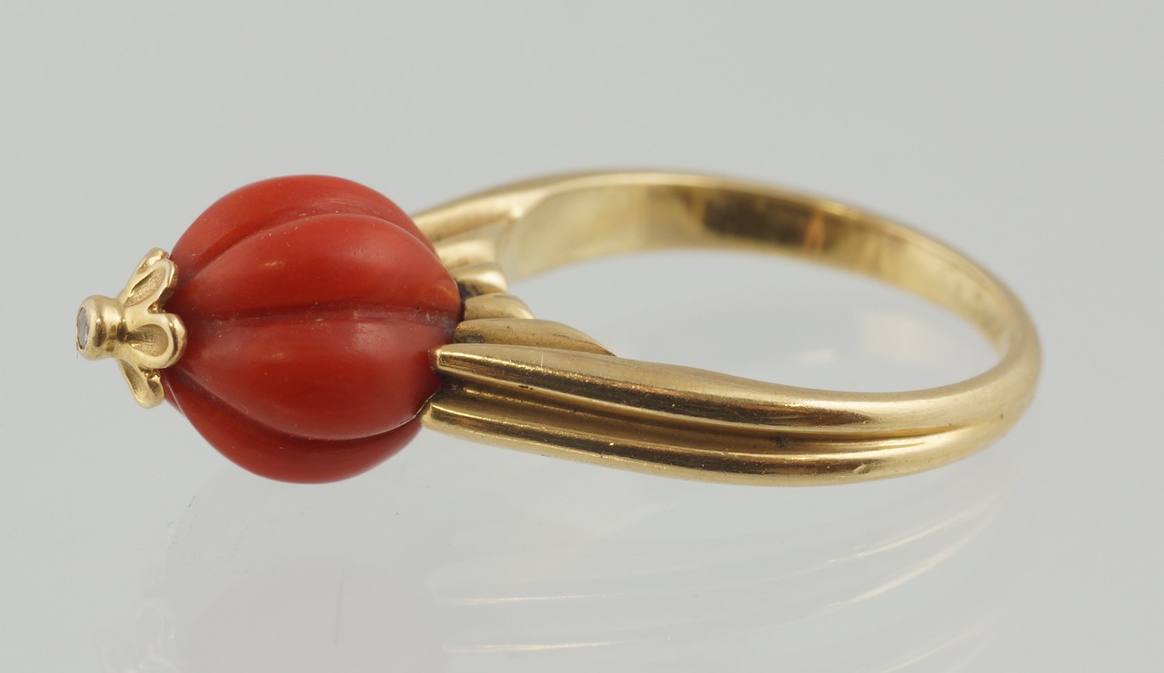 Appraisal: K YG and ribbed melon carved coral ring small diamond