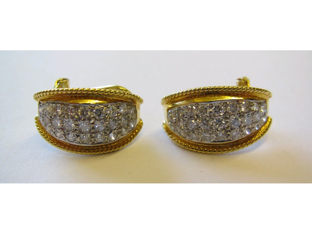 Appraisal: Pair of ct bi colour gold diamond earrings of elliptical