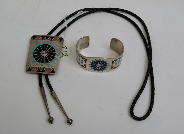 Appraisal: ZUNI STERLING CUFF BRACELET BOLO TIE pieces in Sun God