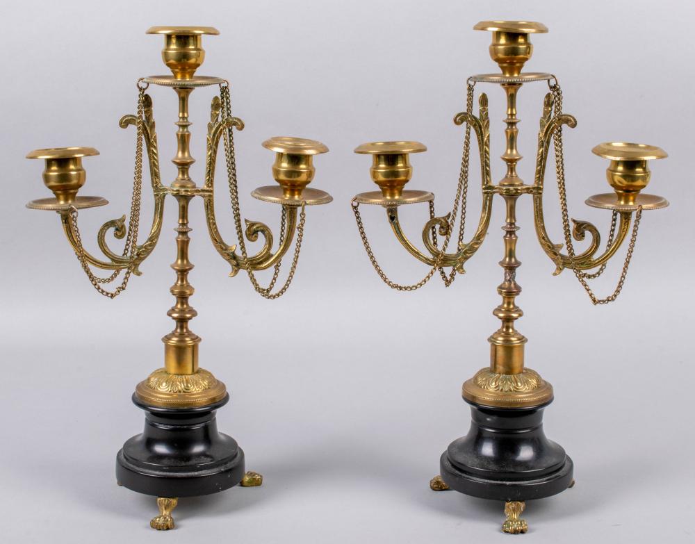 Appraisal: PAIR OF BRASS CANDLESTICKS TH CENTURY both with three candle