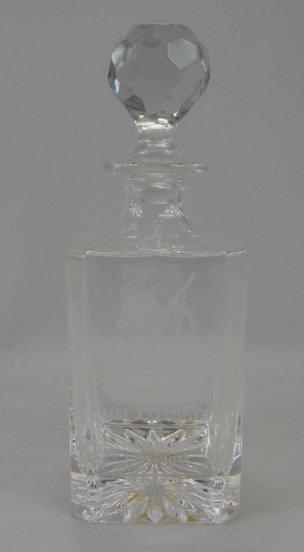 Appraisal: A square section glass decanter with etched type decoration of