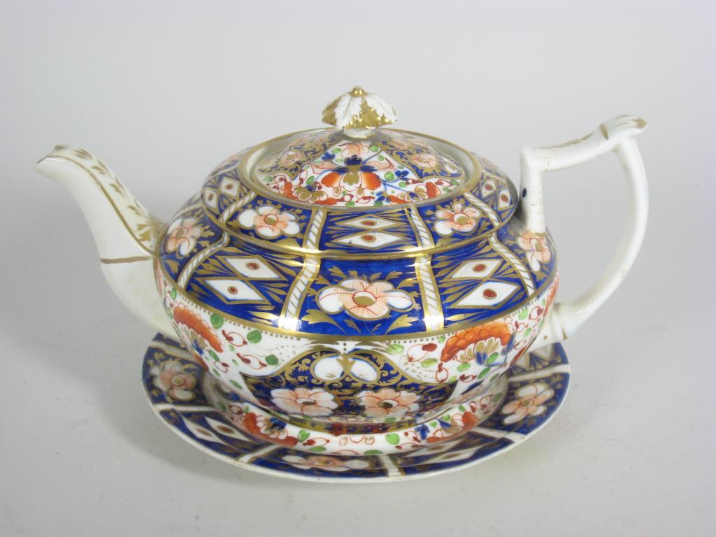 Appraisal: A th Century Derby Teapot and Stand floral painted in