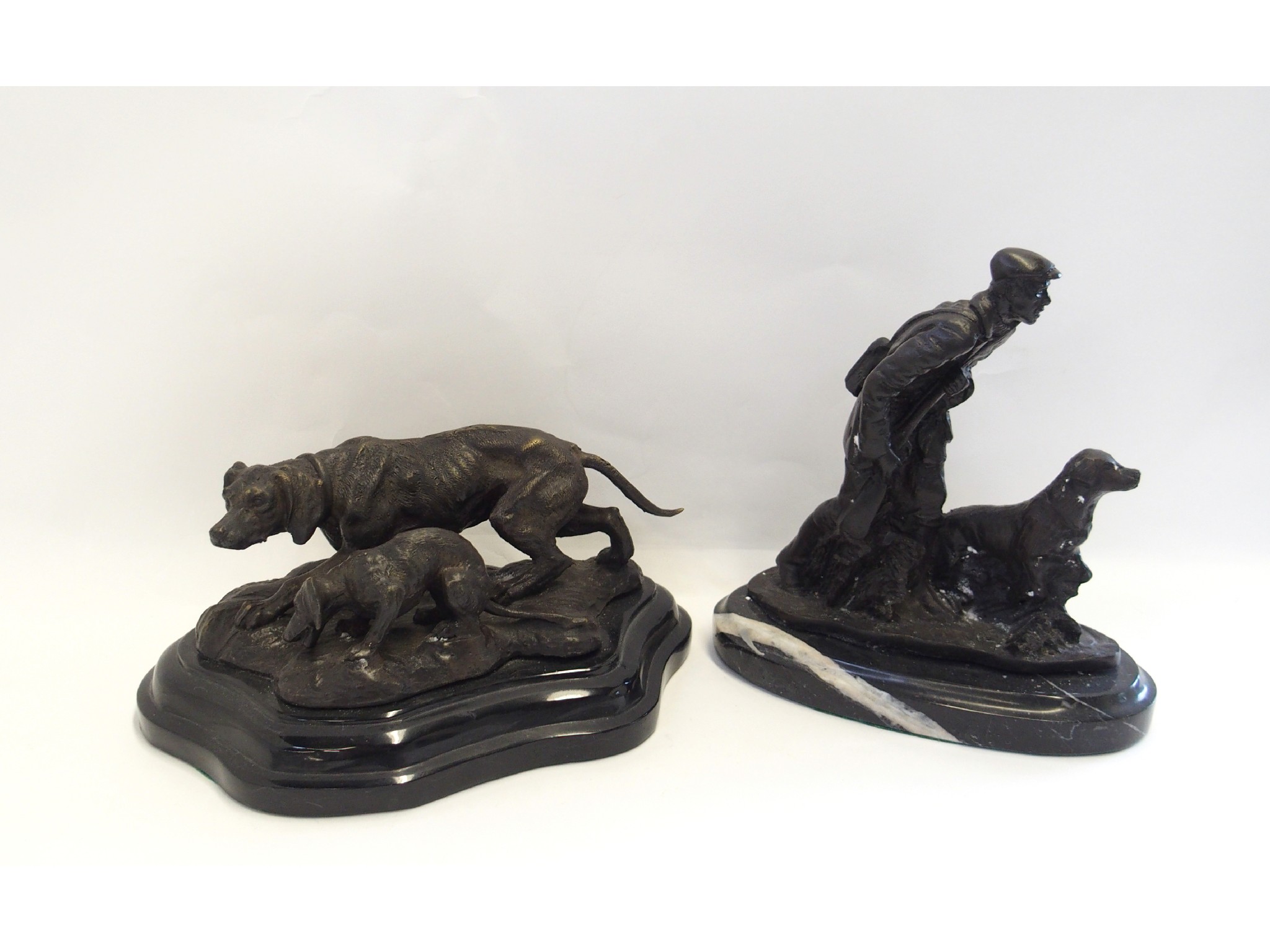 Appraisal: Bronzed metal figure of a dog and puppy and another