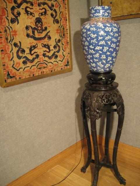 Appraisal: A Chinese marble-inset pierce-carved wood stand The stand with carved