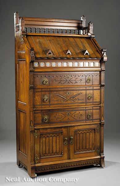 Appraisal: An American Modern Gothic Carved and Incised Walnut Bureau late