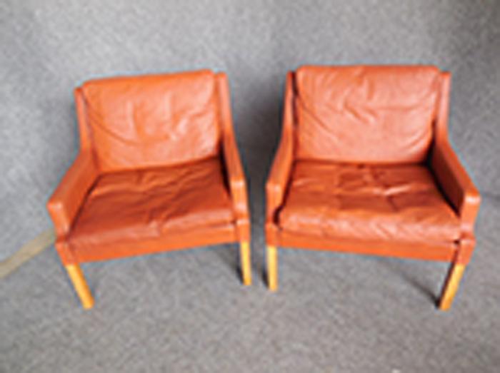 Appraisal: PAIR OF BURNT ORANGE LEATHER ARMCHAIRS DESIGNED BY RUD THYGESEN