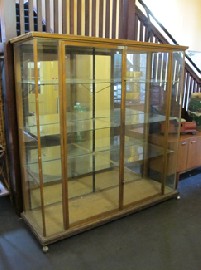 Appraisal: LARGE TWO DOOR WOOD FRAMED GLAZED DISPLAY CASE