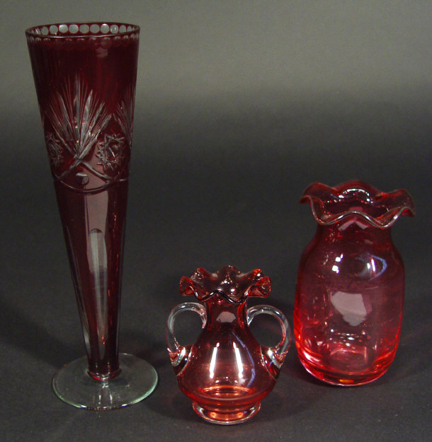 Appraisal: Ruby cut glass vase of tapering form and two cranberry