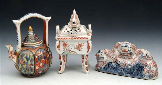 Appraisal: A MEISSEN MINIATURE TEAPOT AND COVER decorated in an oriental