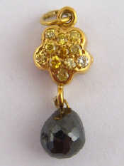 Appraisal: An carat yellow gold fancy yellow diamond and briolette black