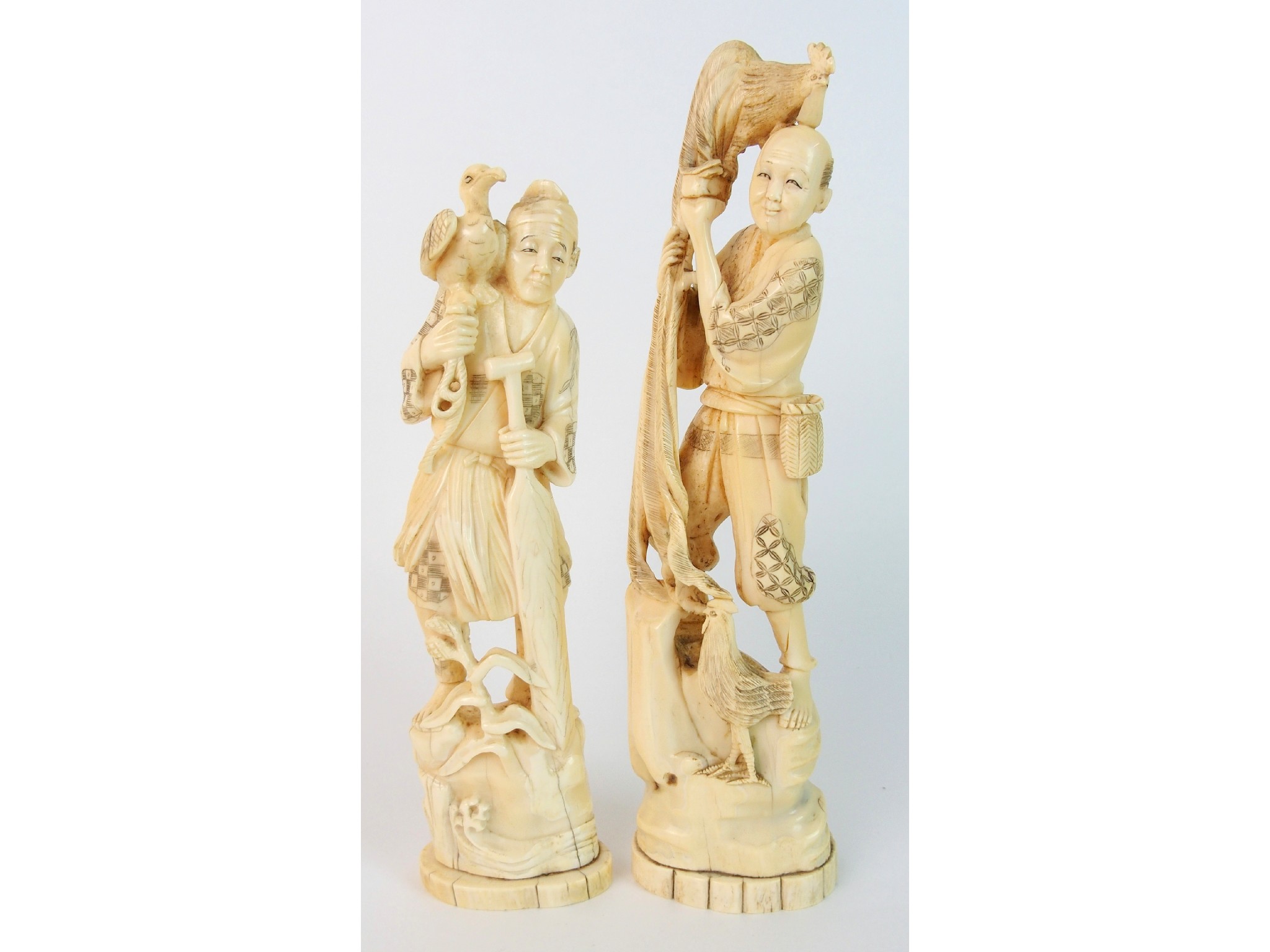 Appraisal: A Chinese ivory okimono of a fishermanwith cormorant on his