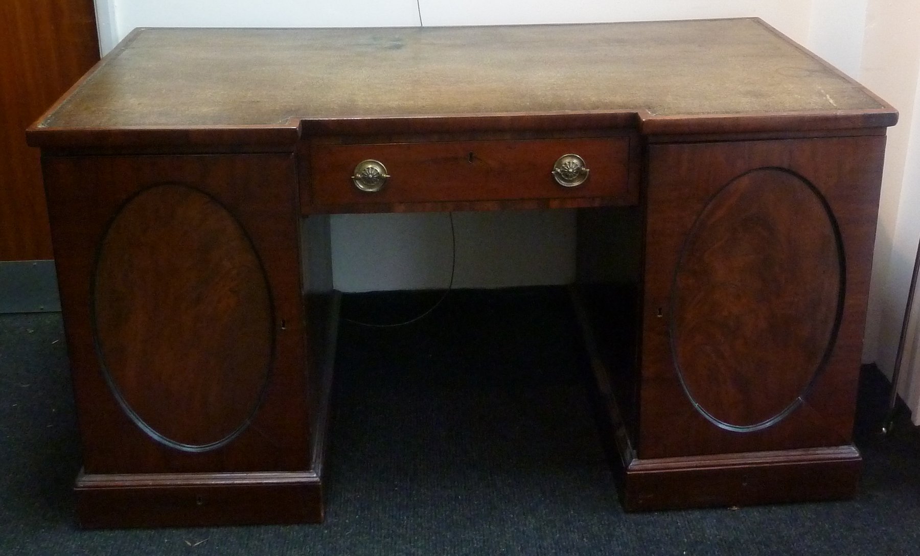 Appraisal: An early th Century pedestal writing desk the leather inset