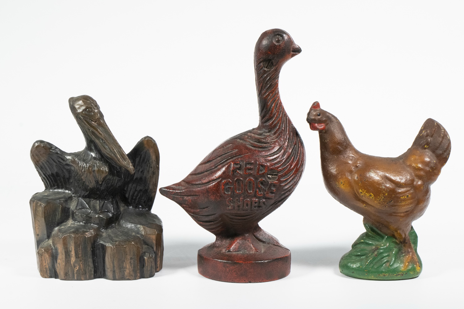 Appraisal: BIRD FORM STILL BANKS Including Hen in painted cast iron