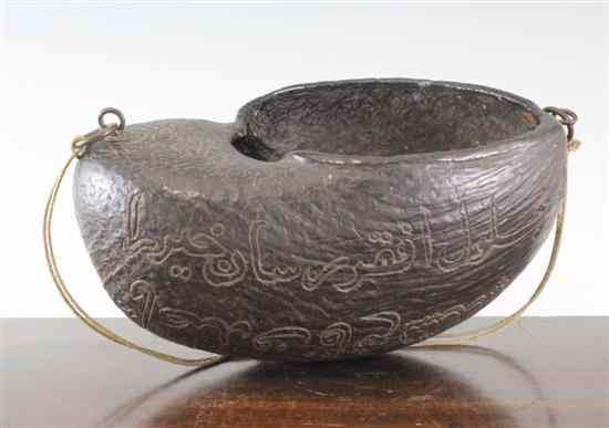 Appraisal: An Islamic coco-de-mer kashkul probably Persia th th century incised