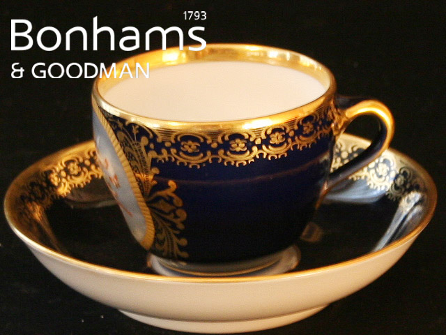 Appraisal: A KPM cup and saucer painted with a roundel of