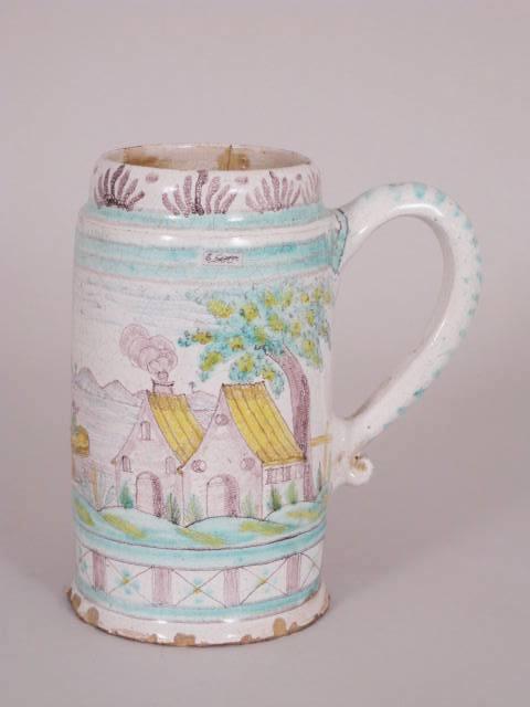 Appraisal: An th Century Gmunden Tankard painted in yellow green blue