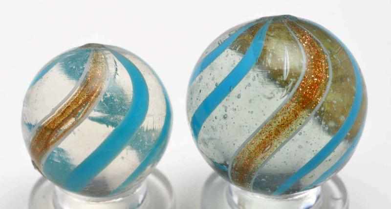 Appraisal: Lot of Lutz Marbles Description Both with clear bases and