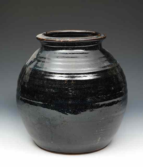 Appraisal: A studio pottery stoneware tenmoku glazed bulbous vase possibly Michael