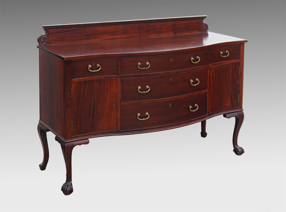 Appraisal: SERPENTINE MAHOGANY SIDEBOARD Backsplash with dentil molding and decorative carved