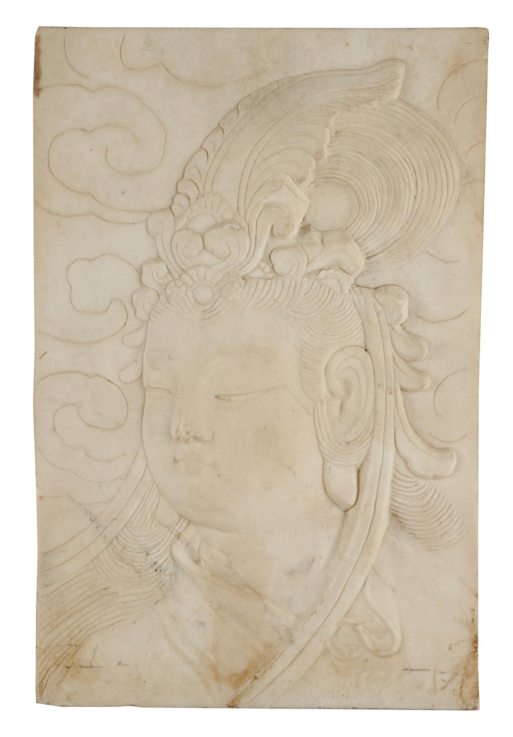 Appraisal: CHINESE CARVED MARBLE PLAQUEdepicting Guanyin Condition with slight staining to