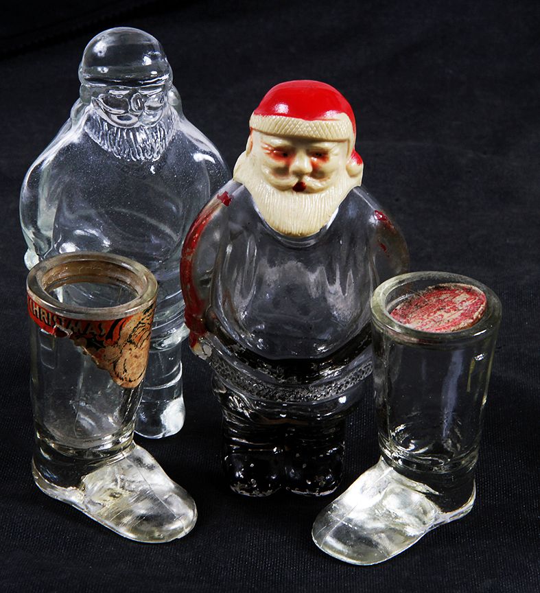 Appraisal: Christmas Candy Containers A group of four with two Santa's