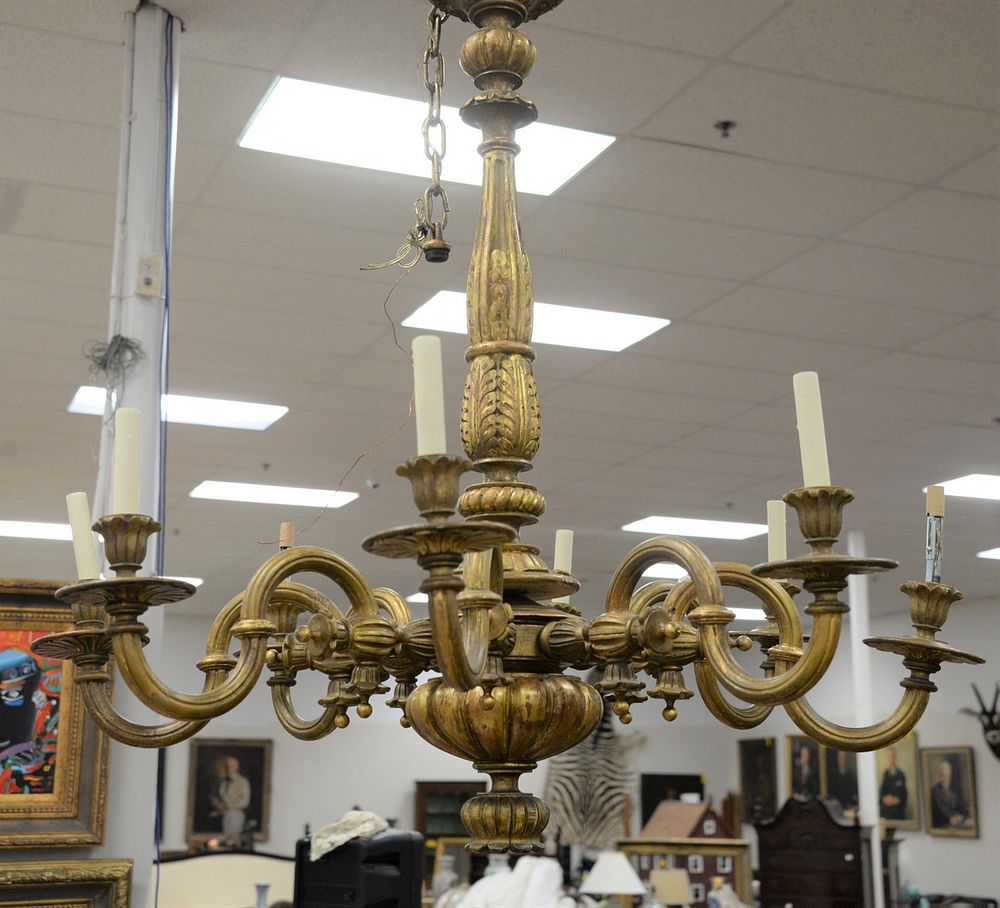 Appraisal: Italian giltwood eight-light chandelier with fluted arms gadrooned stem and