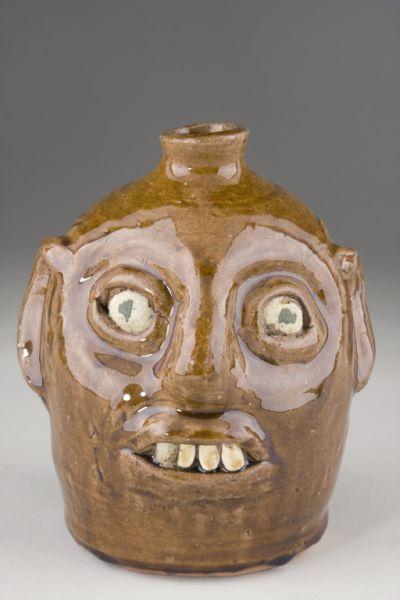 Appraisal: Reggie Meaders Georgia Pottery Face Jug appears to be an